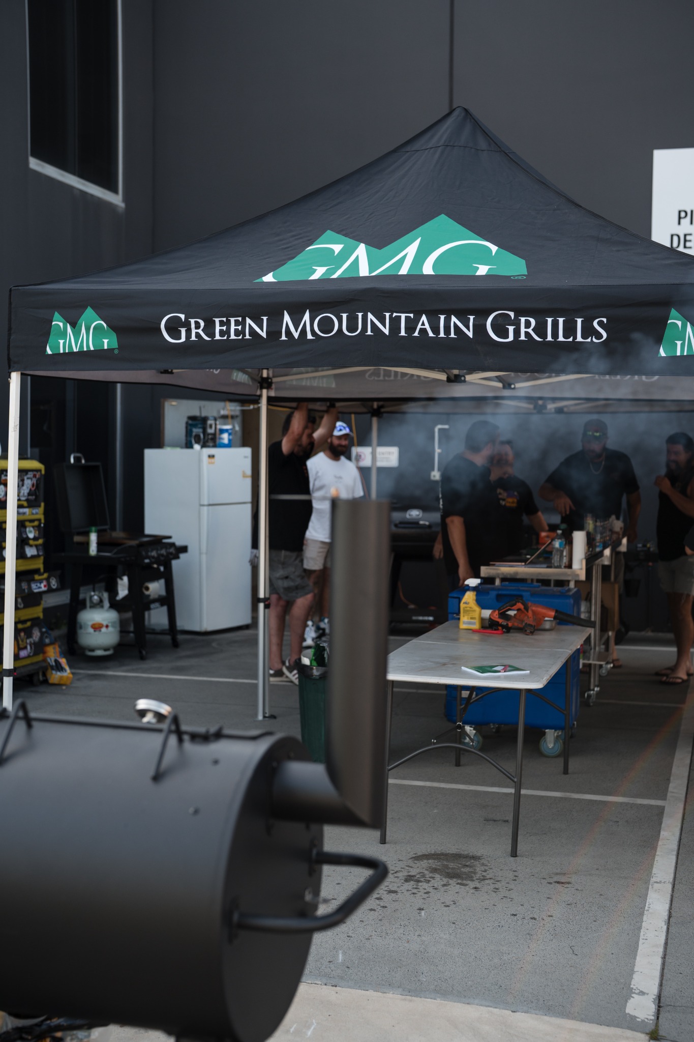 Smoke School cooking station beneath the class marquees