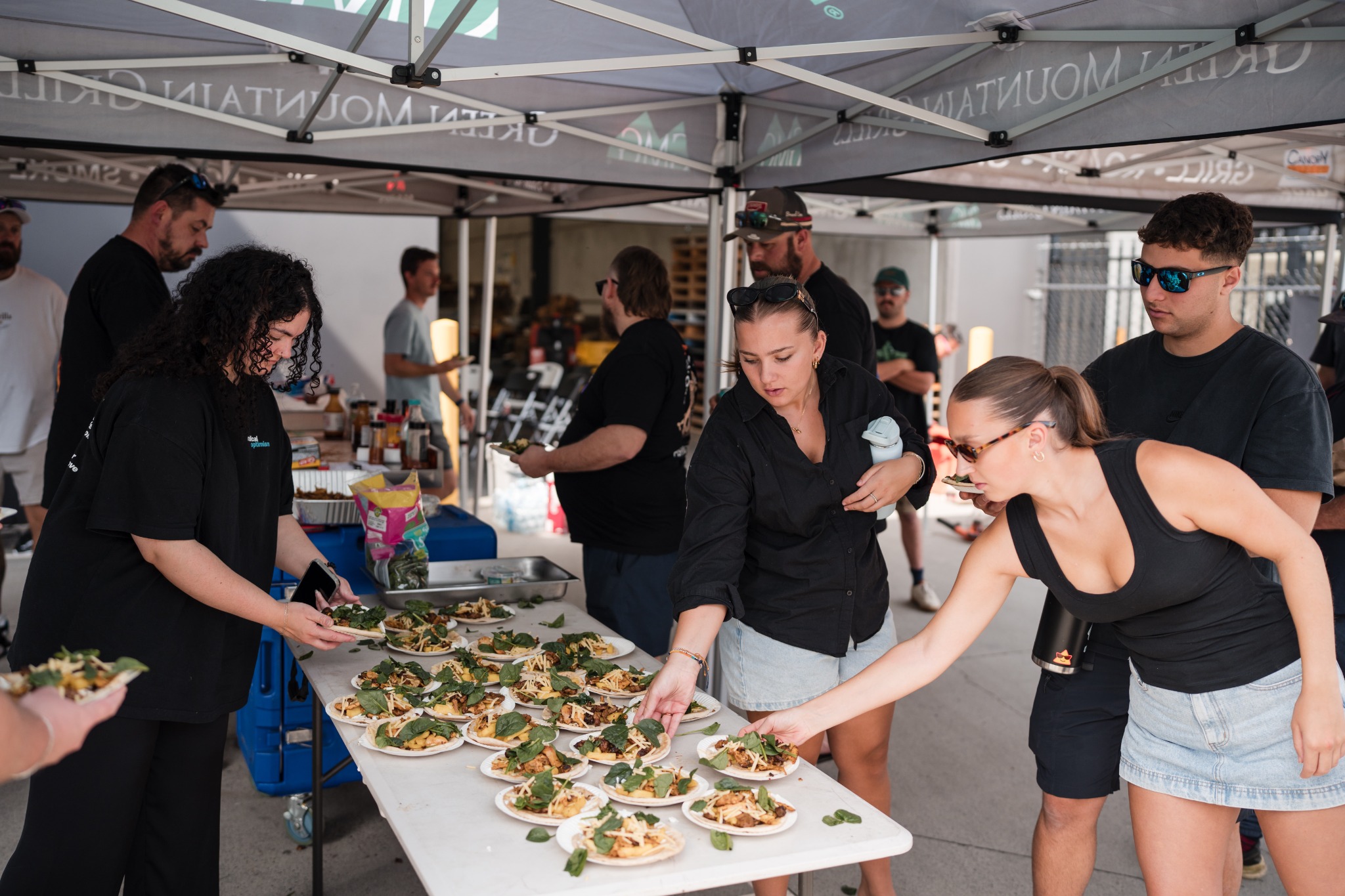The Smoke School crew plating food for attendees