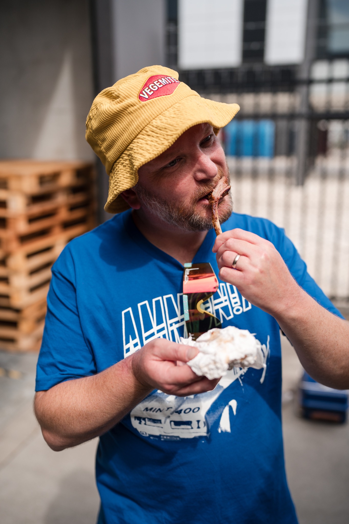An attendee tasting food prepared during Smoke School
