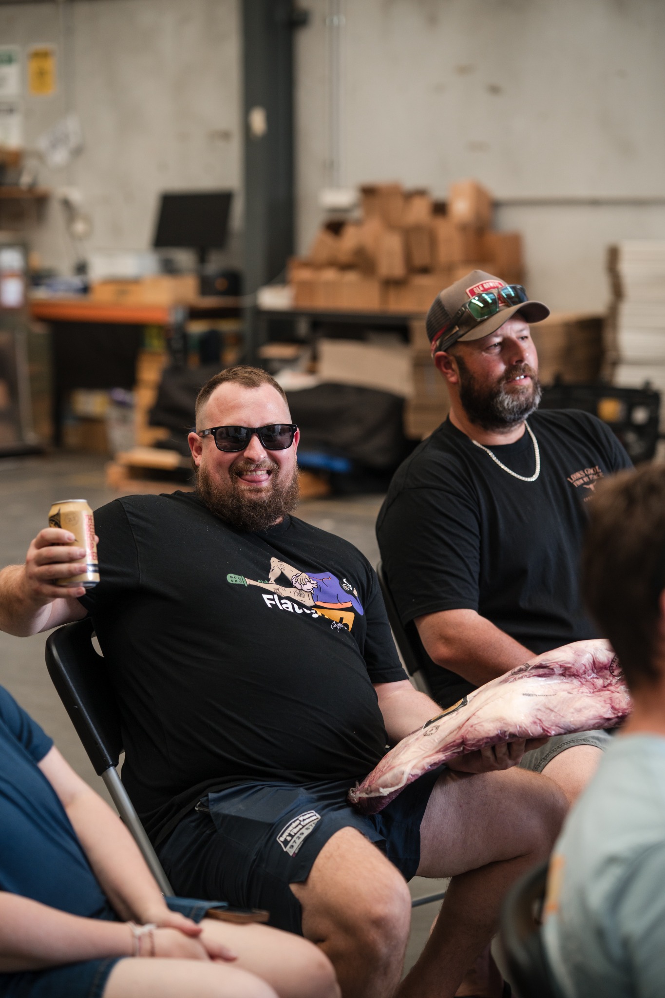 Two Smoke School attendees with meat ready to cook